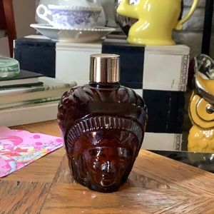 Vintage old perfume bottle native chief with a headdress
